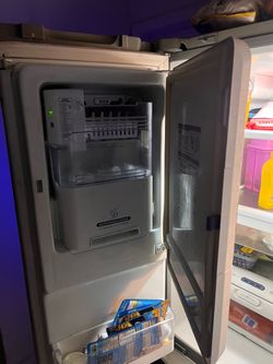 Great silver ice maker kenmore refrigerator still in good condition and works very well