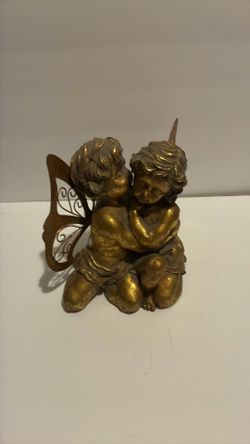 Cherub/fairy looking figures house decor