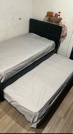 Twin size trundle bed set. Good condition and no scratches or tears. Already disassembled and ready to move out. Comes with 2 used mattresses. Great f