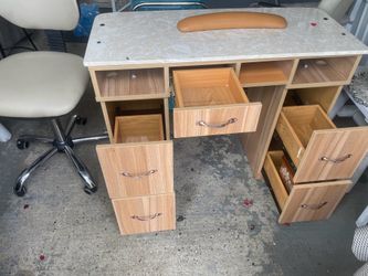 Professional manicure table two chairs and an organizer cart used and in like-new condition. The tabletop is made of marble.