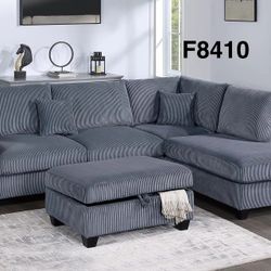 GREY SECTIONAL WITH RIGHT SIDED CHAISE. STORAGE OTTOMAN INCLUDED 