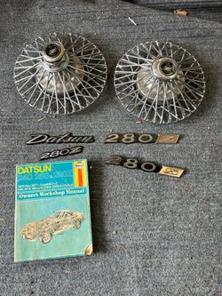 280Z wire wheels (2) + Caps, emblems, and manual