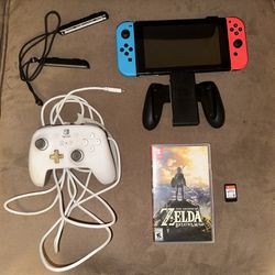 Nintendo Switch w/  Wireless Controller, Joy cons, and 2 games.