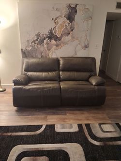 Brown power reclining couches