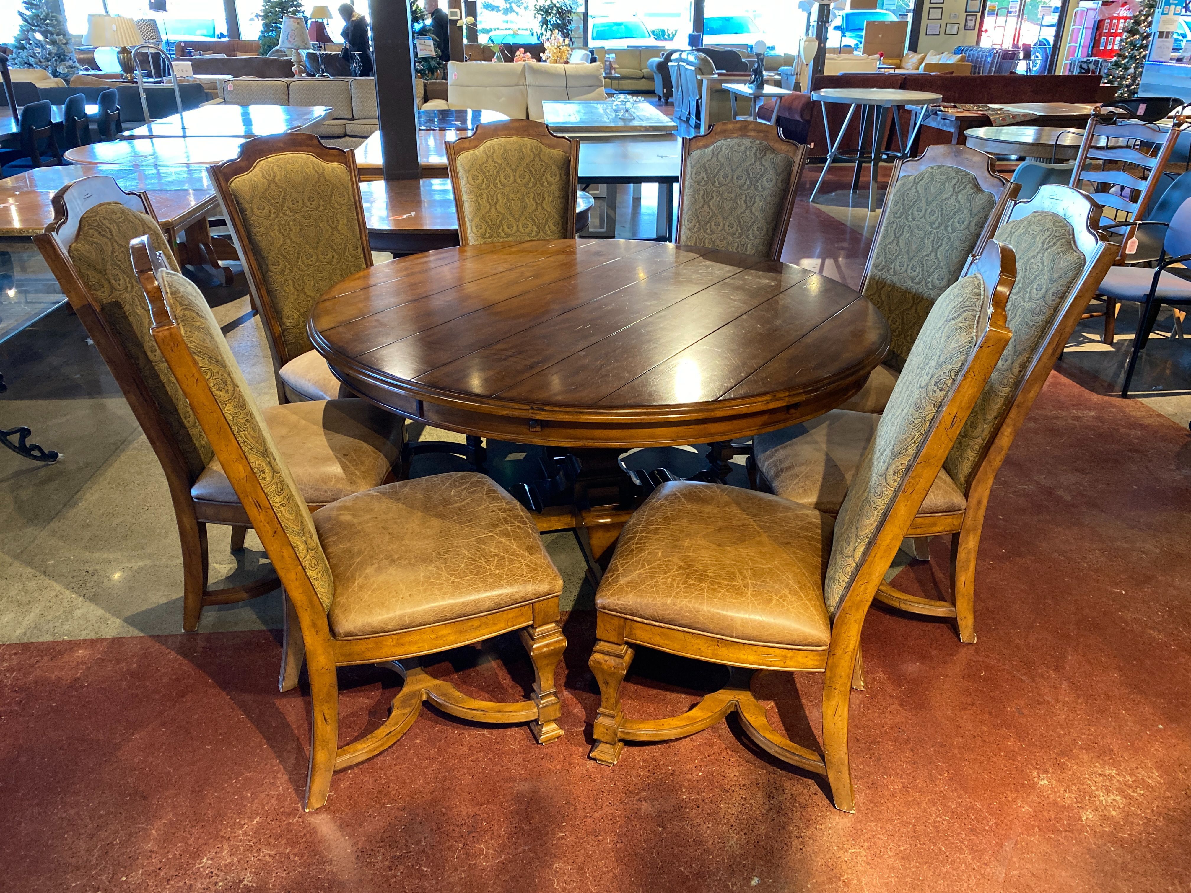 STANLEY Santa Barbara 64″ Circular Dining Table with Eight Upholstered Dining Chairs