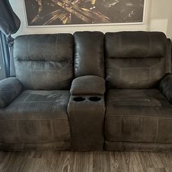 2 dark gray electric recliners