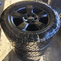 Clean set of 20 inch black LTZ rims with Toyo Open Country A/T tires. All matching 33x12.5R20 LT tires. Has 6 lugs. Fits Chevy Silverado, Tahoe, Subur
