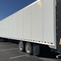 2010 Vanguard Trailer with etrac, roll up door and liftgate. 48x102