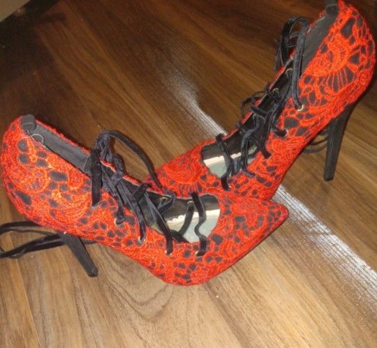 Red strappy high heels size 7 unique embroirdery and only used once