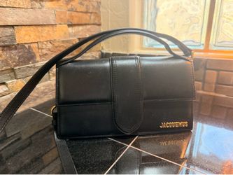 Jacquemus Le Grand Bambino leather top-handle bag.