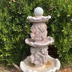 marble fountain, fishes  and dolphins