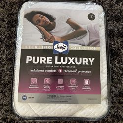 Luxurious Sealy Sterling Collection Pure Luxury ultra soft mattress pad. Twin size, 39 x 75 inches. Has Microban antimicrobial protection and moisture
