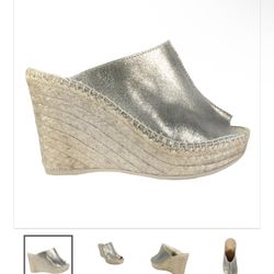 Size 5 Cici in Pewter   Metallic leather upper Slip on Almond shaped peep toe Leather insole Rubber sole Made in Spain Measurements: Heel height:  4" 