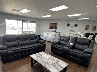 Black leather double reclining sofa