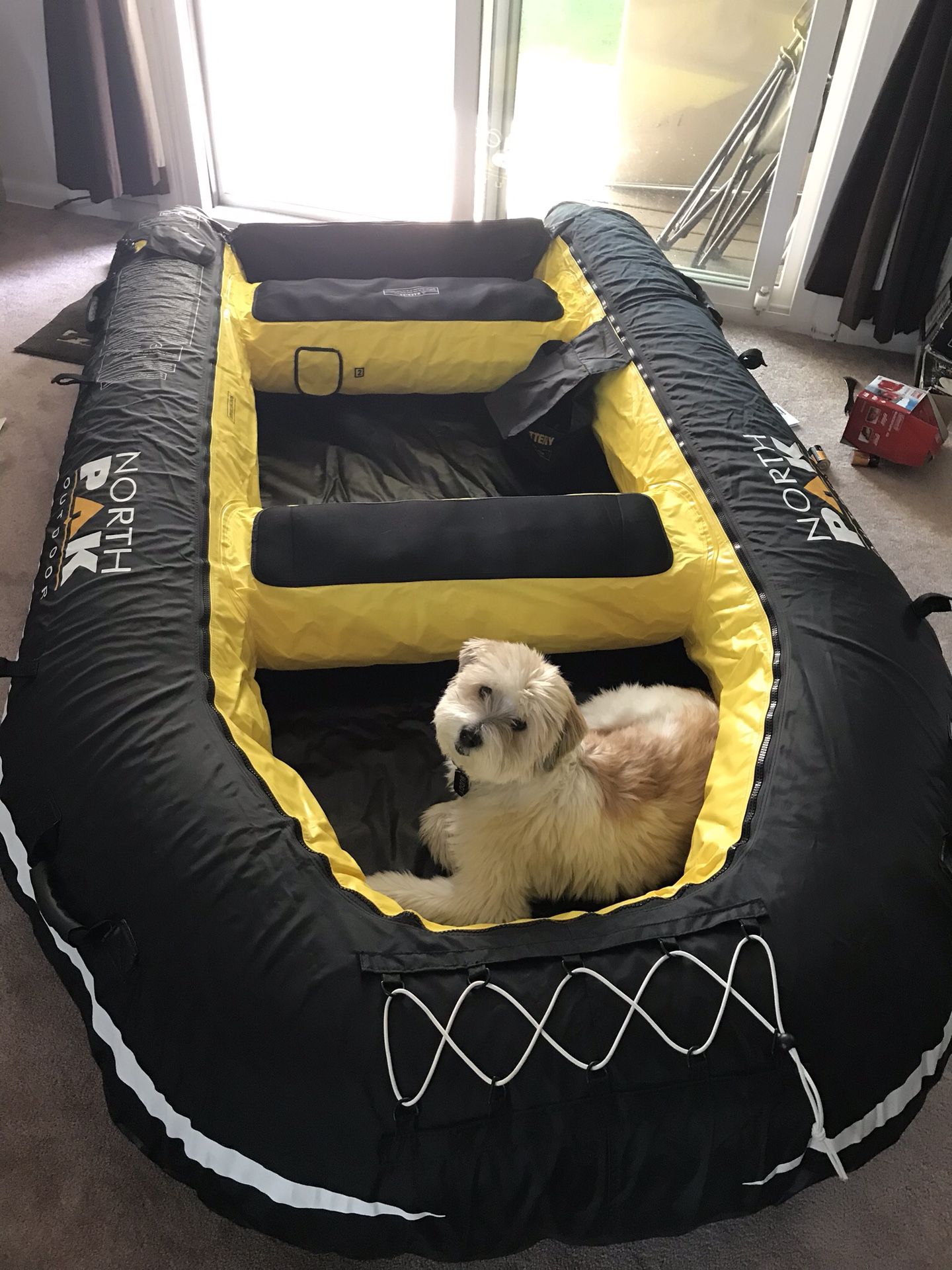 NORTH PAK 8ft inflatable boat with a set of aluminum oars.