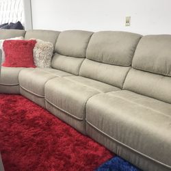 HUGE TAN OR GRAY SECTIONAL WITH 3 RECLINERS. SAME DAY DELIVERY AND EASY FINANCING.
