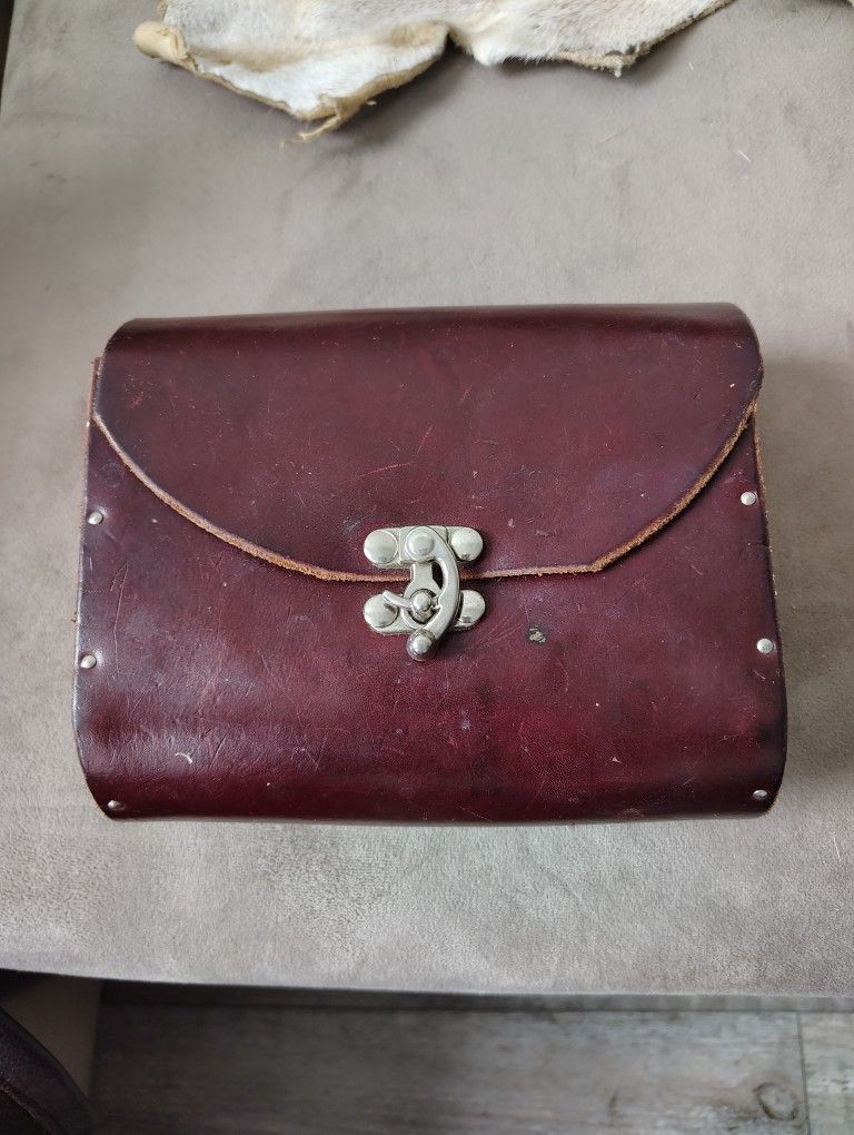 Handmade Leather Satchel With 1/2 Inch Wooden Sides. 7 Inch Wide By 6 Inch Tall. Depth Of The 5.5 Inches. Back Belt Loops And Circle Nickel Enclosure 