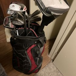 Golf Clubs, Balls And Pitching Net