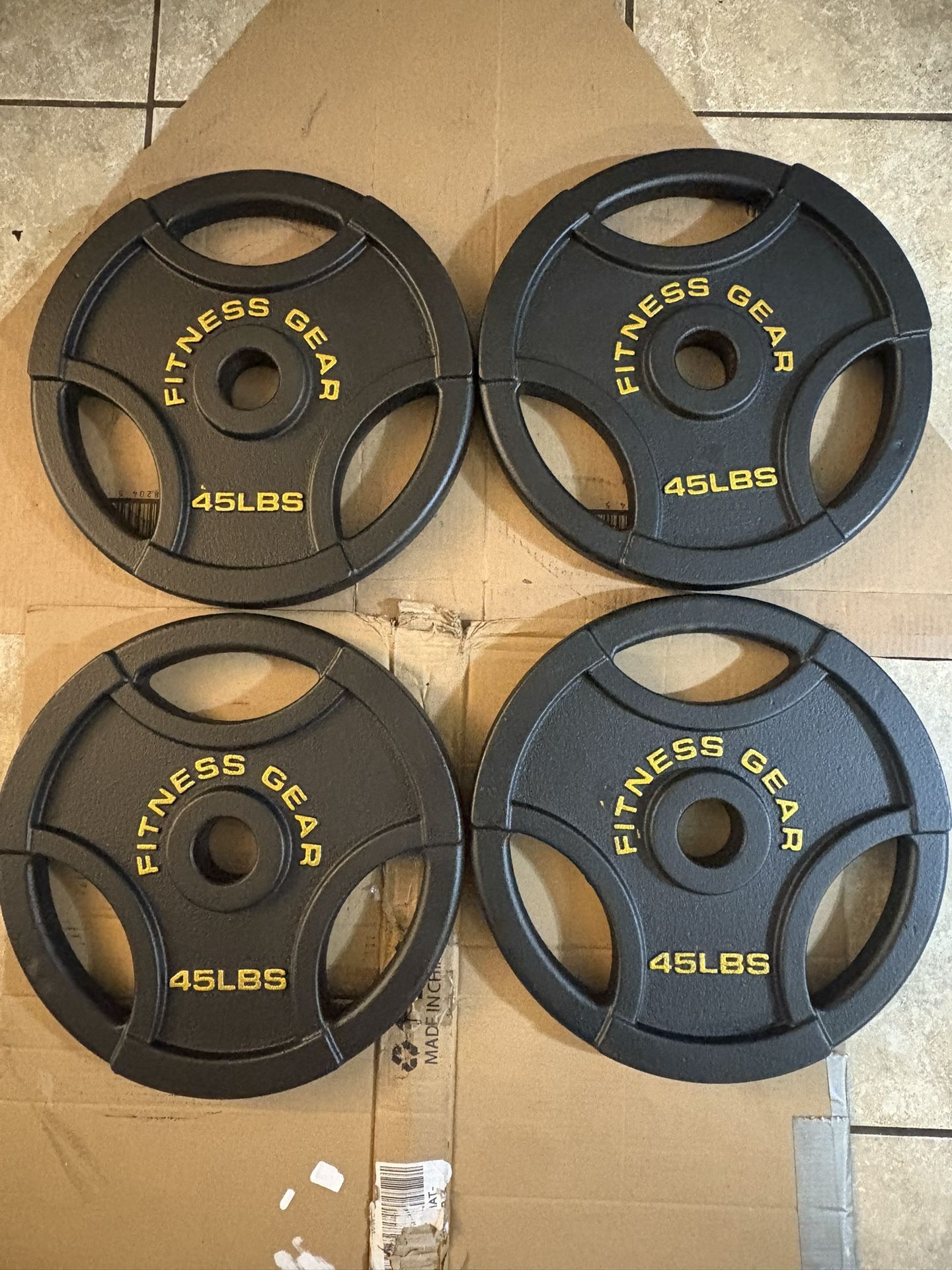 Four 45lb Olympic Plates