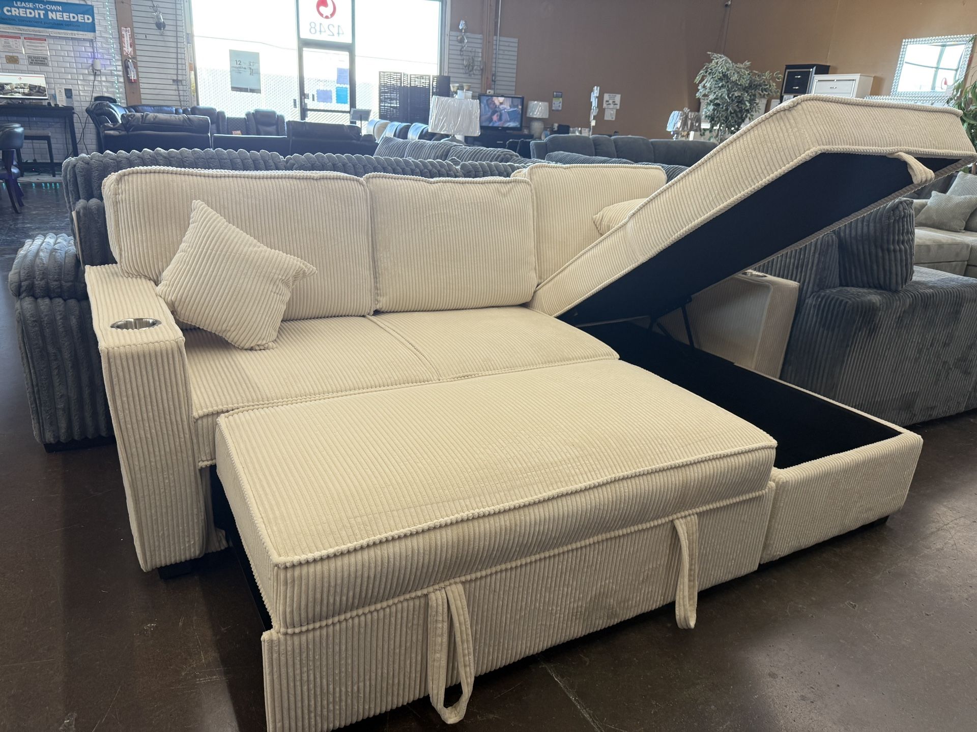 Beige Corduroy Sectional With Pull Out Ottoman