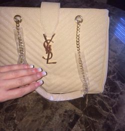Beautiful beige handbag with gold chain