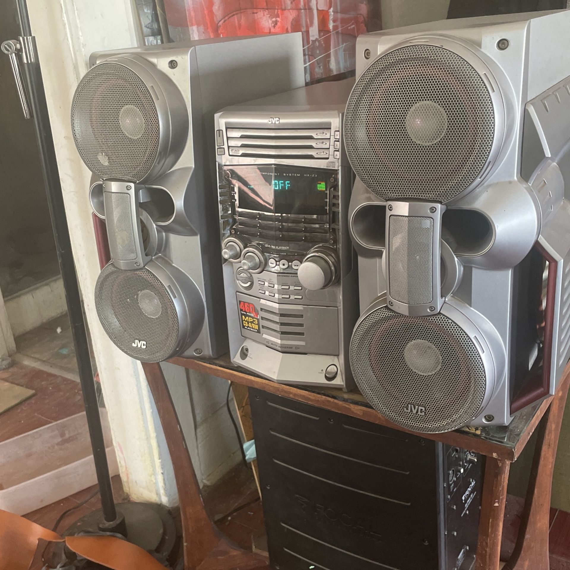 Massive JVC shelf stereo system. Built In subwoofers