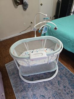 Fisher Price Soothing Motions Bassinet W/ sound machine, light projector, and under storage