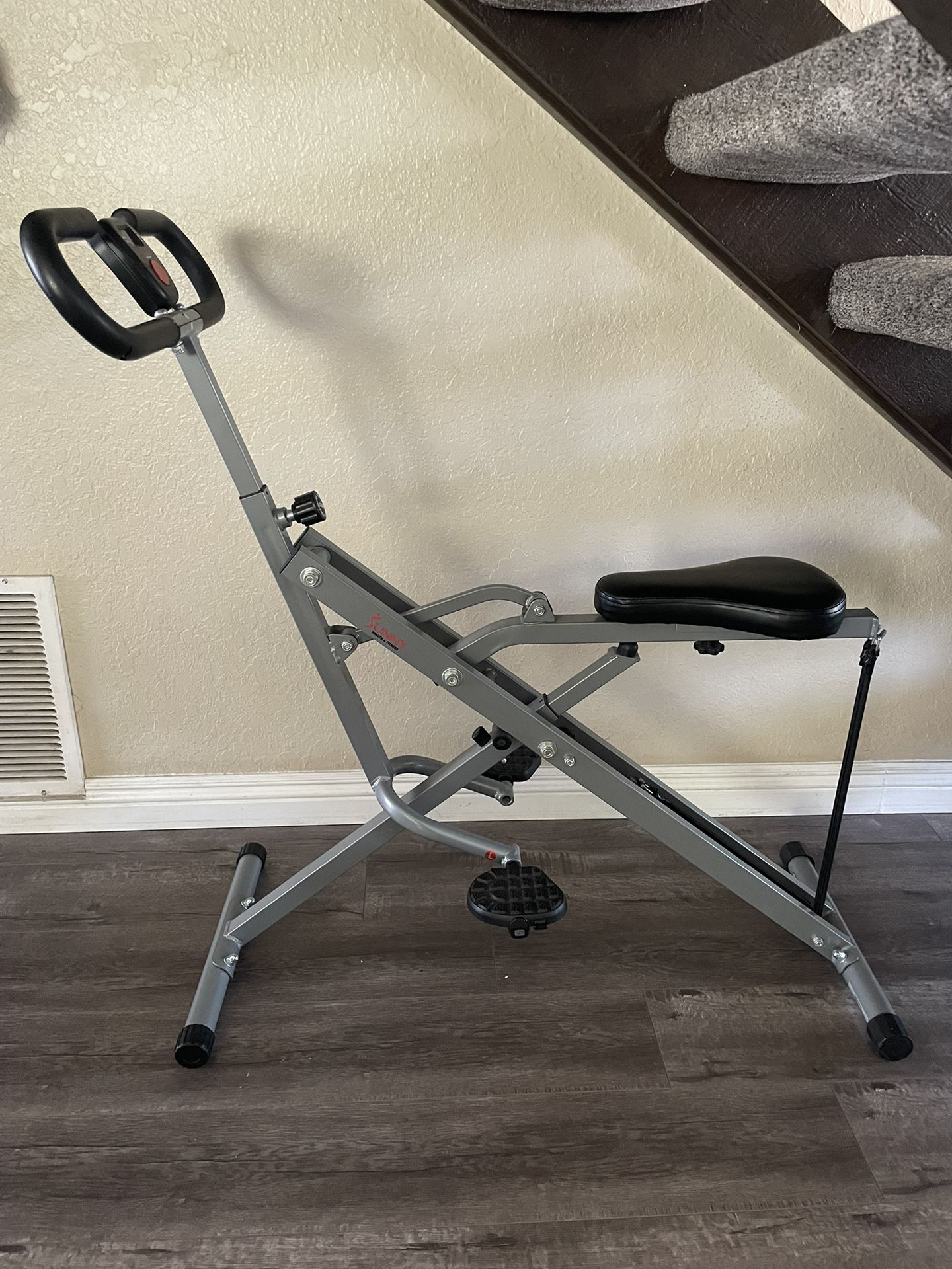 Sunny Health & Fitness Exercise Row-N-Ride Squat Assist Trainer Upright Squat Machine for Glutes & Legs Workout with Adjustable Resistance