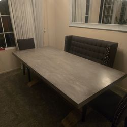 Concrete table with three chairs