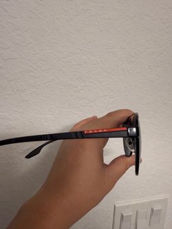 Prada shades with Prada hard case costed $550