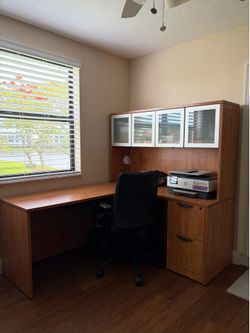 Complete L Shaped Desk. Included: 1 LDesk 1 Pedestal-File/File 1 Hutch with 4 glass doors. Color Cherry.