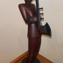 Guy playing  a Saxophone