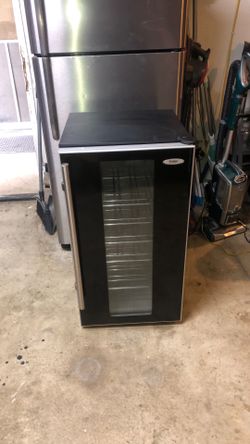 Haier black cabinet and glass door stainless steel handle wine cooler refrigerator