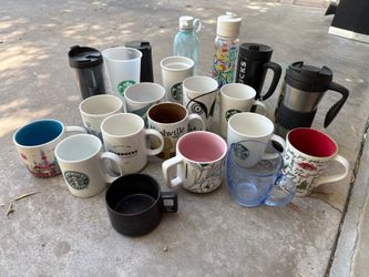Collection of used Starbucks mugs, and tumblers