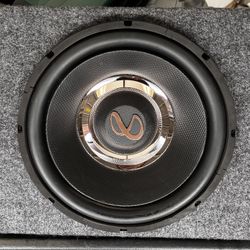 Infinity Primus 1270 car subwoofer mounted in a carpeted enclosure. 
