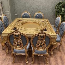 Luxury Dining Set LOOK UP A contemporary gilded dining table with eight upholstered chairs. TIME PERIOD 21st Century ORIGIN Contemporary Luxury ESTIMA