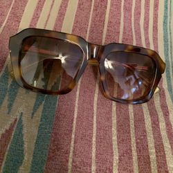 Brown tortoise shell sunglasses (La Jolla Boutique)