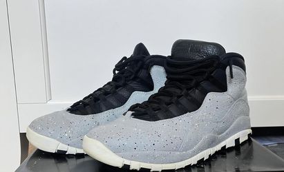 Air Jordan 10 Retro sneakers 'Cement' size 11 released in 2018, featuring a speckled light smoke grey leather upper and black accents.