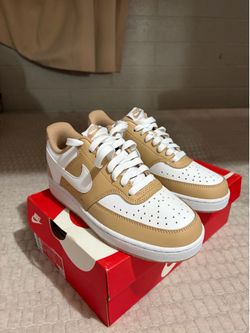 Nike,beige, and white colored shoes