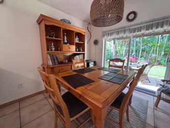 Classic solid wood golden honey dinning room extendable table with four chairs and hatched amour complete set everything for $300 OBO estate sale.