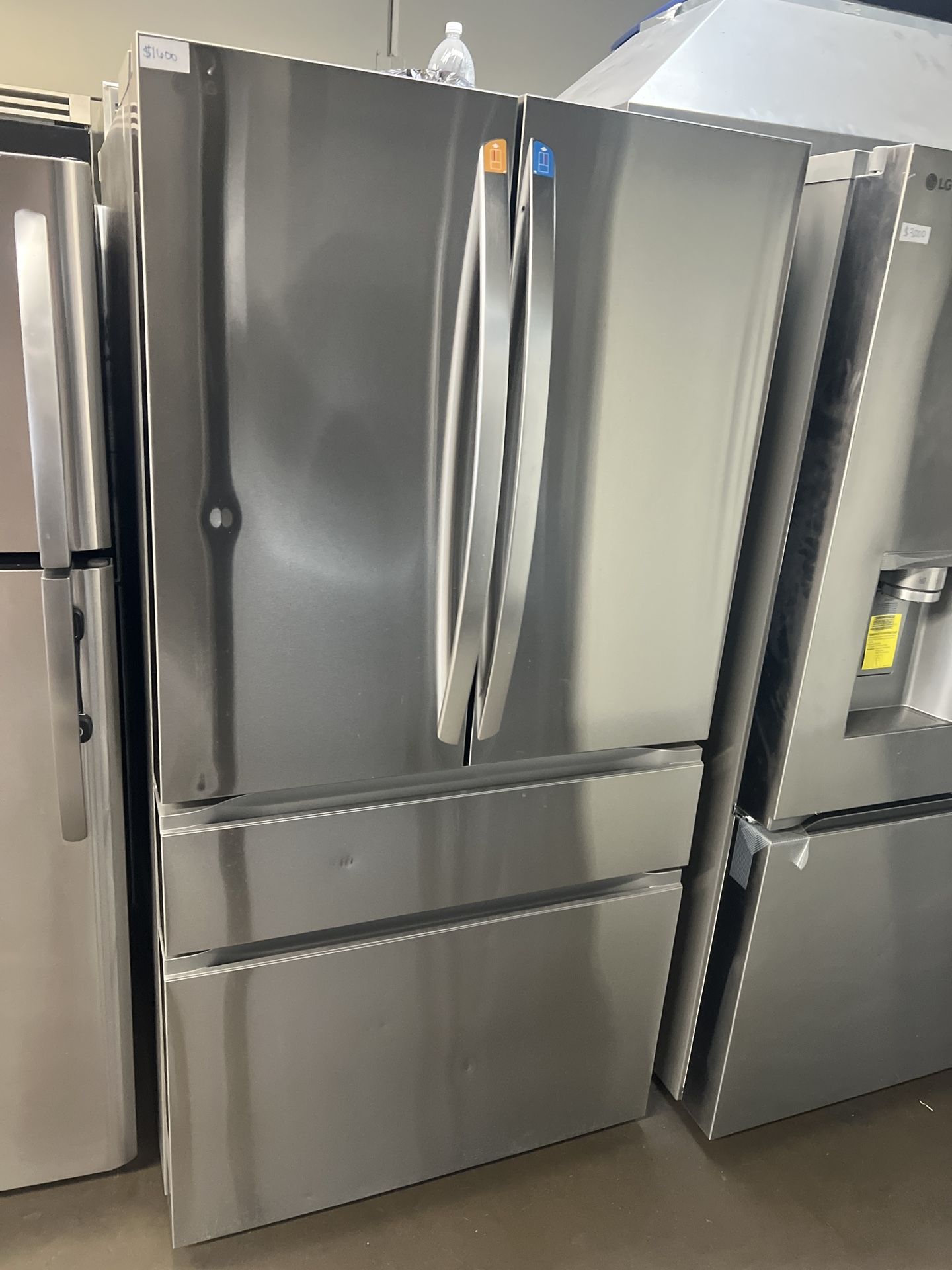 OPEN BOX LG FOUR DOOR STAINLESS STEEL REFRIGERATOR WITH INTERNAL WATER/ICE 