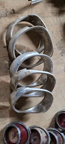 65 chevrolet impala headlight light bezels.