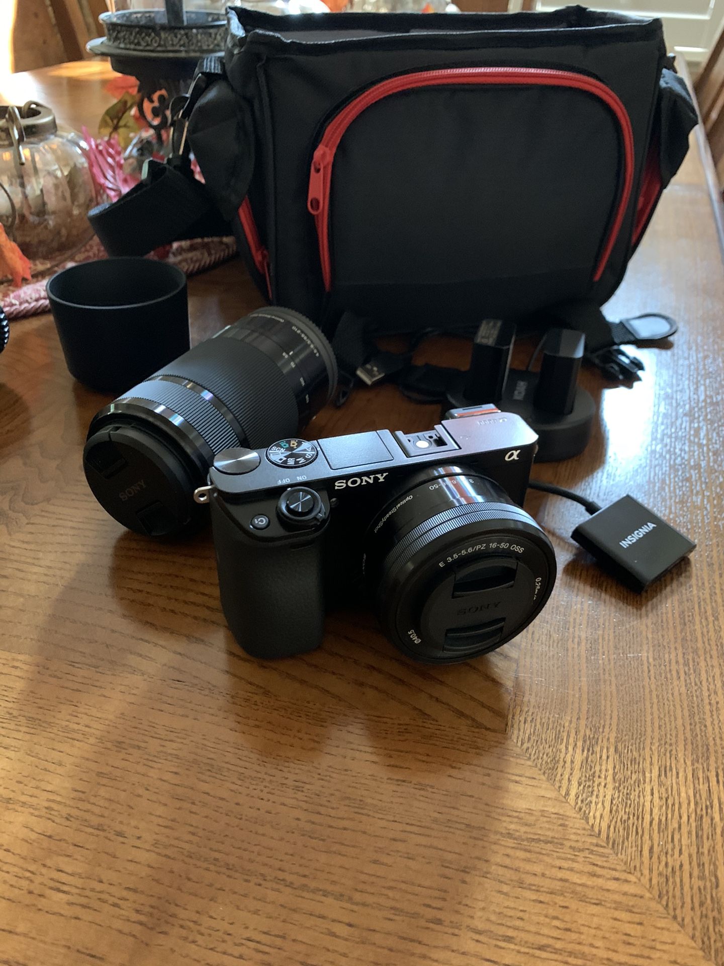 Sony A6000 Camera with 2 lenses, 3 batteries, and travel bag