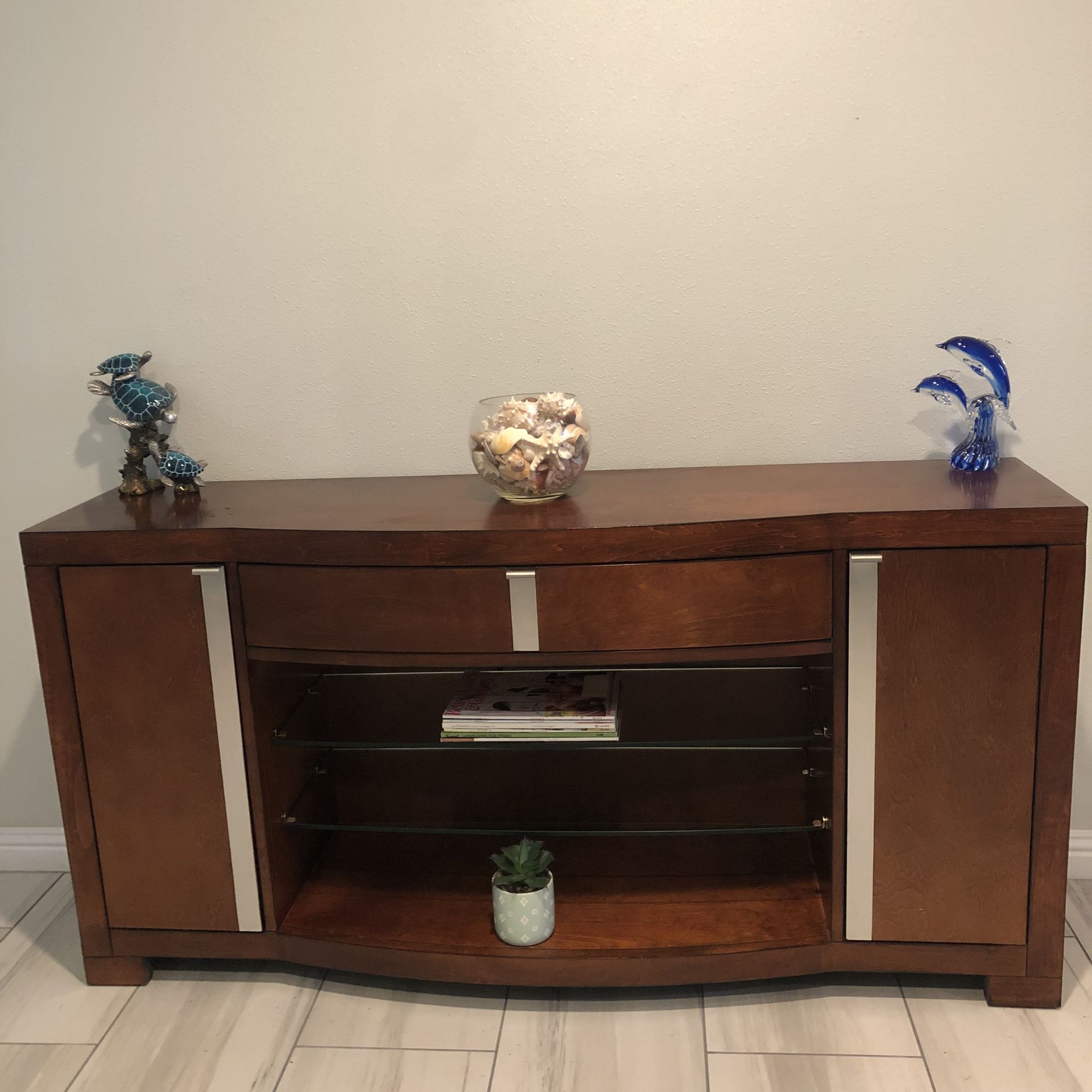 Large TV stand with floating center tick Tempered Glass Shelves. Built w/2 doors and 1 drawer. (Vanity or Dresser) Design by Ashley