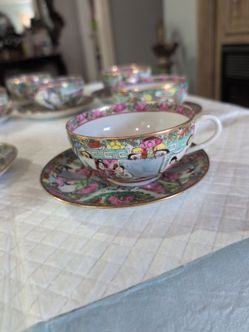 Vintage Japanese porcelain hand-painted cup and saucer set