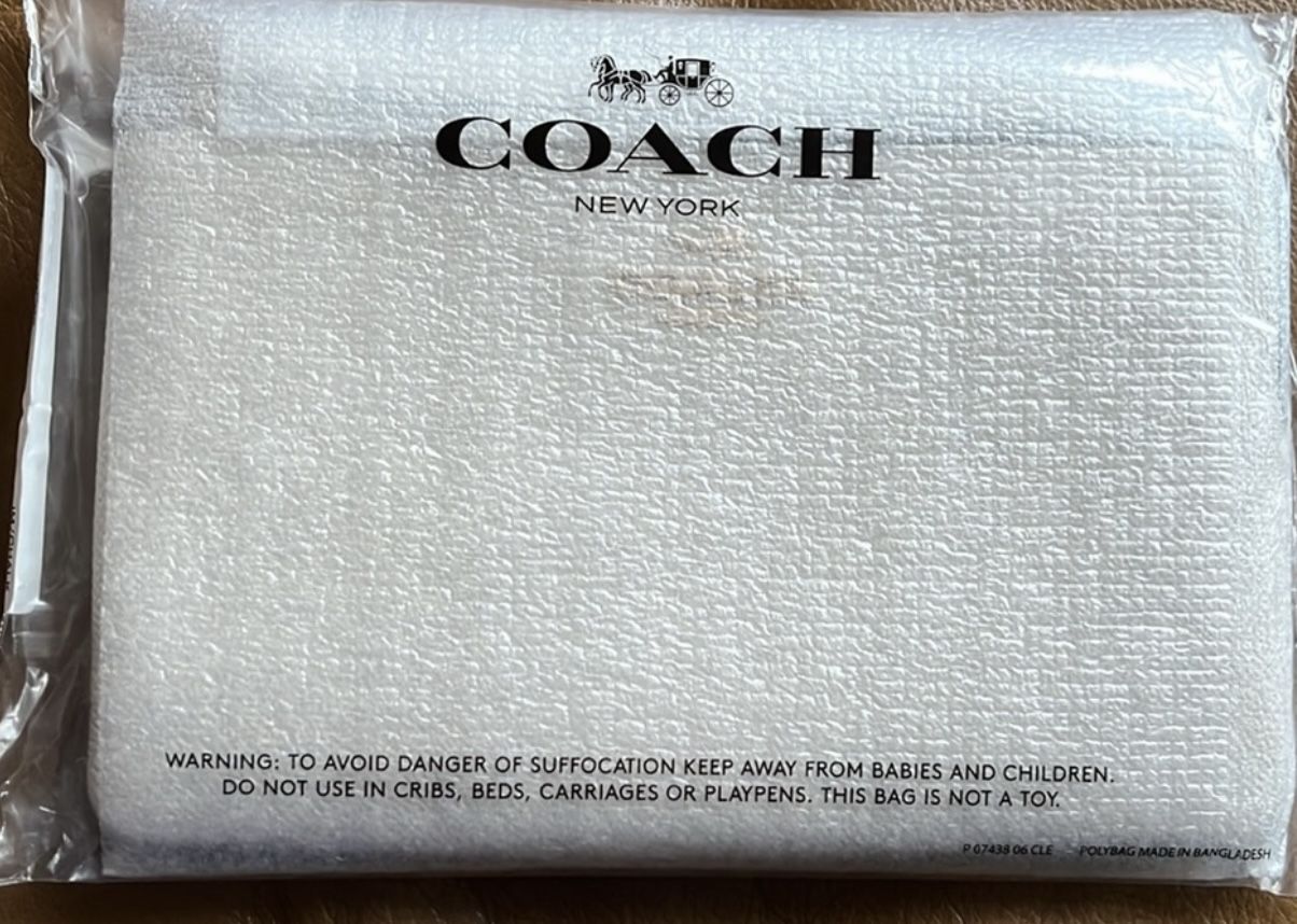 Brand New Coach Large Corner Zip Wristlet Brand New Coach Large Corner Zip Wristlet  Color: Chalk/Gold Retail:$118.00 Pick up only 77090