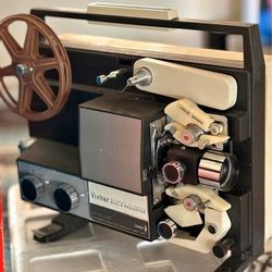  Vivitar Dual 8 Motion Picture Projector, specifically a Model 733A. 
This is a vintage projector designed to play both 8mm and Super 8 film formats, 