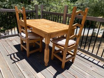 Rustic wood table and four chairs