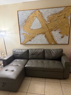 Sectional couch and wall frame.