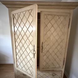 French Provincial (or French Country) style armoire cabinet.